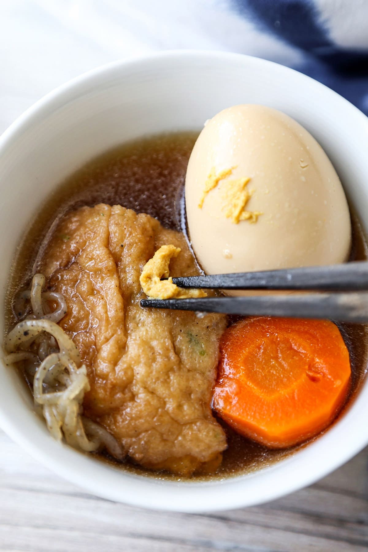 oden with egg, fishcake, and mustard