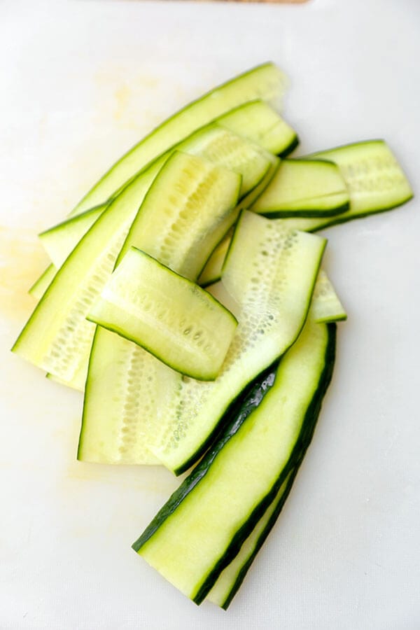 Pickled cucumbers are so versatile and delicious! They pair well with salads, sandwiches, mains and can be served as a side dish or a snack. And the best part? They only take 5-10 minutes to make and 30 minutes to marinate! Here are some of my favorite cucumber pickle recipes! #asian #vinegar #pickles #howtomake | pickledplum.com