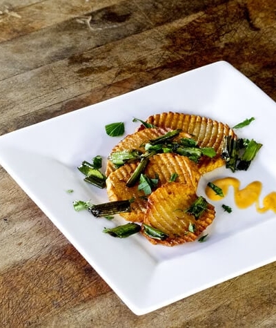 fried potatoes with mayo on a plate