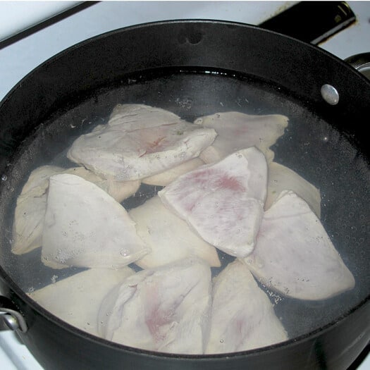 chicken slices in boiling water.