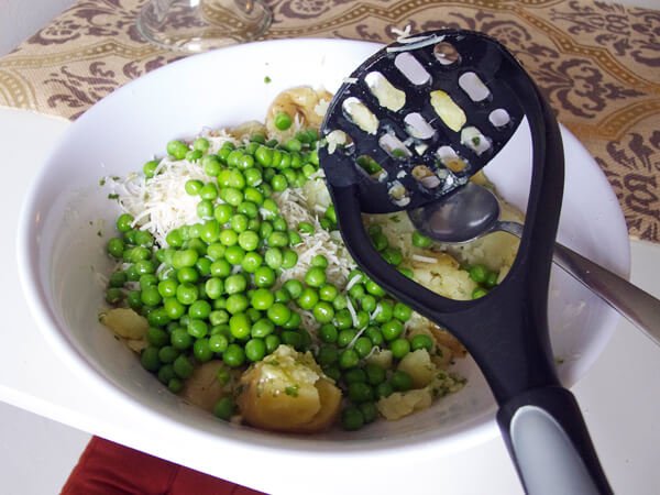bowl of parmesan, peas and potatoes