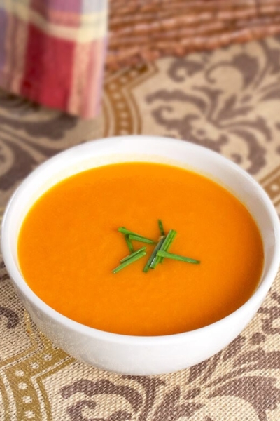 bowl of tomato soup with chives