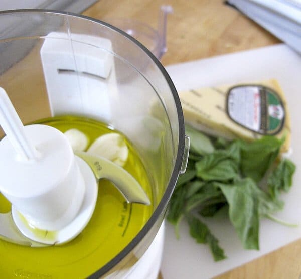 blender with basil and olive oil
