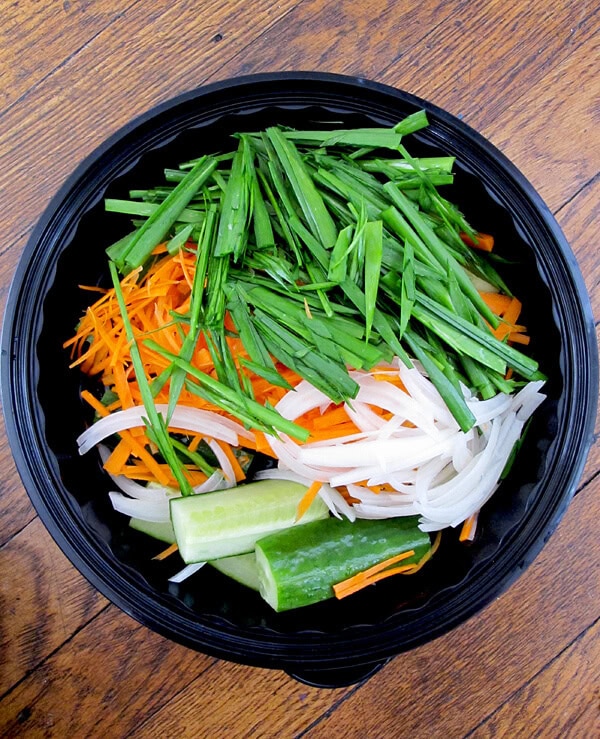 Chopped scallions, carrots, onions and cucumber