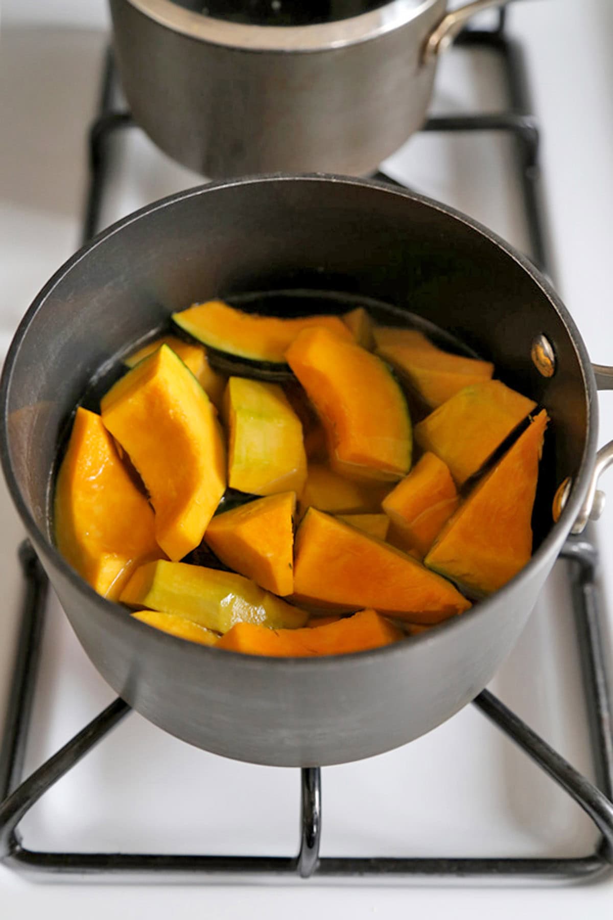 sliced kabocha squash in a pot