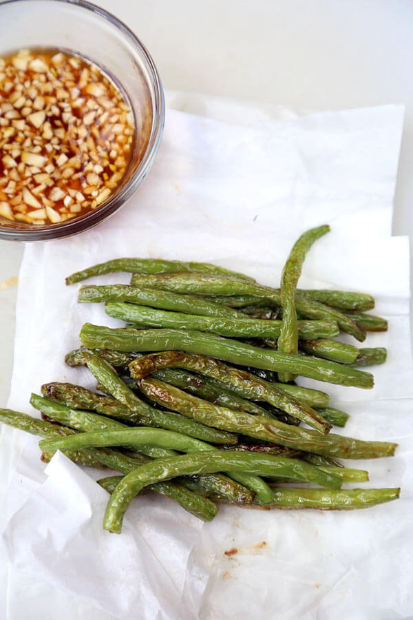 Dry-fried green beans - a delicious Chinese side dishes that's vegetarian and only requires a few ingredients! Savory, garlicky and tender green beans to add to your Asian dinner recipes rotation! #airfryer #chineserecipes #vegetarian #healthyrecipes | pickledplum.com