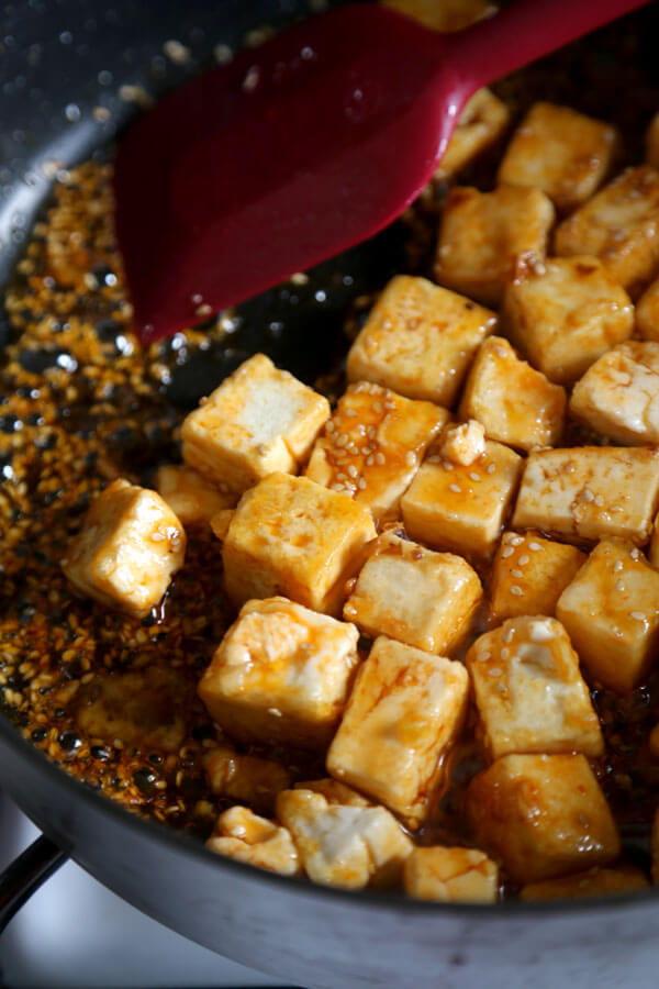 tofu cubes in a pan, sautee with sauce