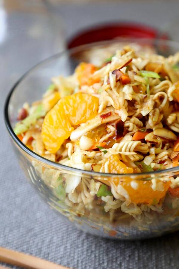 Ramen Noodle Coleslaw - This is an easy ramen noodle salad recipe with cabbage, mandarin oranges, slivered almonds and crunchy ramen noodles, tossed in an oriental dressing that's sweet and tangy. Yummy! #saladrecipe #asiansalad #ramennoodles| pickledplum.com