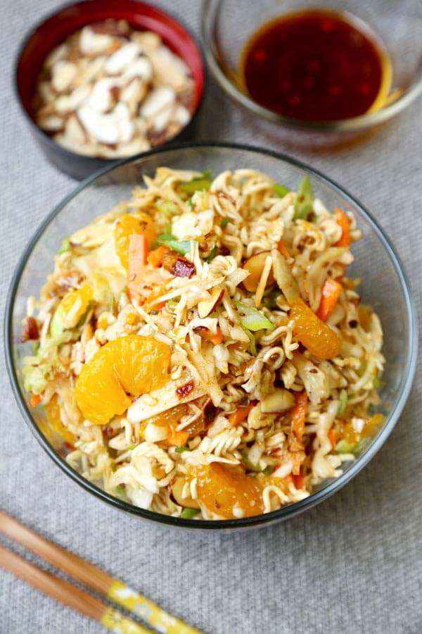 Ramen Noodle Coleslaw - This is an easy ramen noodle salad recipe with cabbage, mandarin oranges, slivered almonds and crunchy ramen noodles, tossed in an oriental dressing that's sweet and tangy. Yummy! #saladrecipe #asiansalad #ramennoodles| pickledplum.com