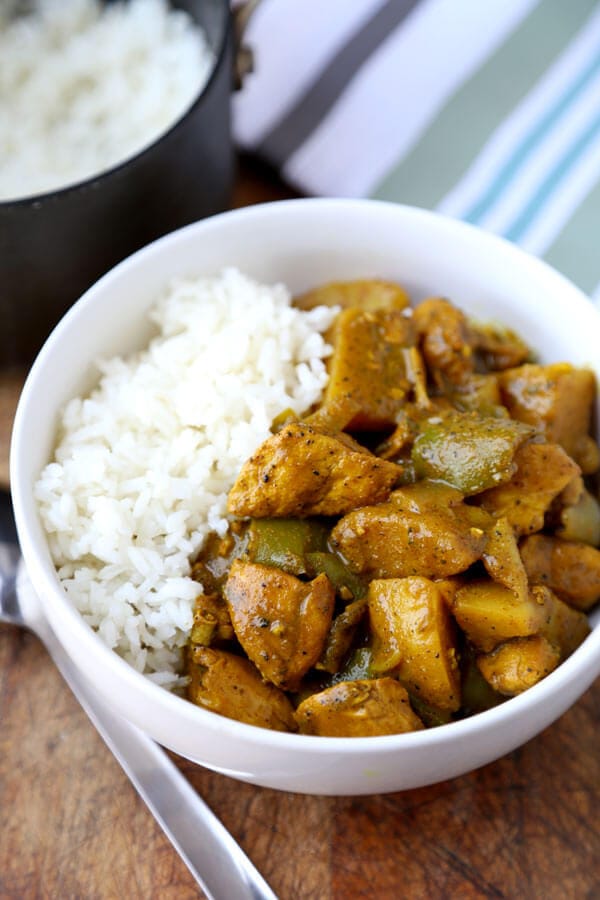 Jamaican Chicken Curry - Hotttt! This Jamaican chicken curry recipe will hit the spot if you are looking for strong and assertive flavors! Recipe, easy, main, stew, gluten free | pickledplum.com