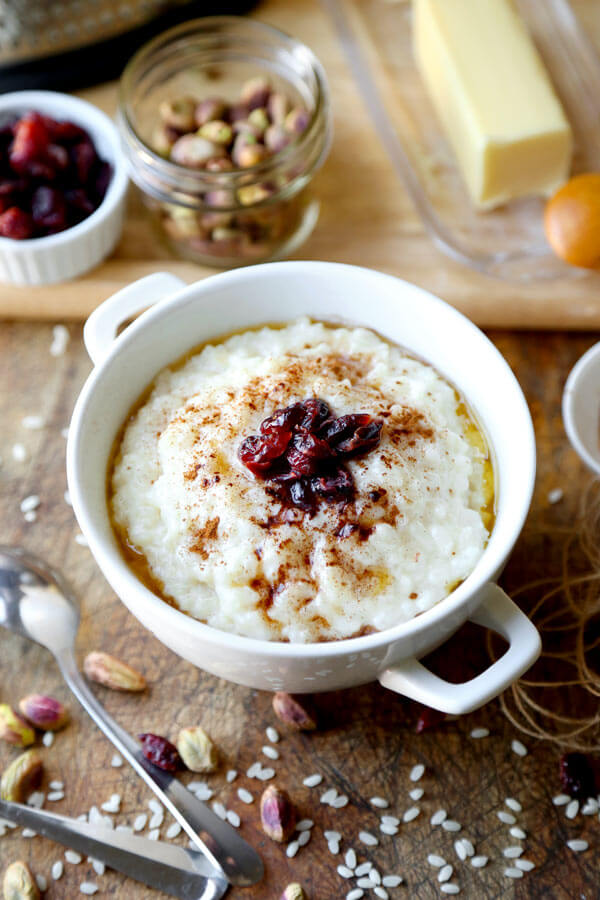 Norwegian Porridge (risgrot) - This is a traditional recipe for Norwegian rice pudding that's rich and creamy. It's the perfect Christmas breakfast bowl (gluten free) that tastes like a decadent dessert. It's the best! #breakfastrecipe #ricerecipes #porridge | pickledplum.com