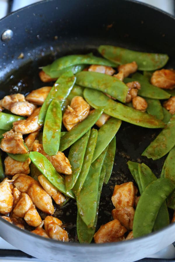 Thai Red Chicken Curry - an authentic thai coconut curry recipe that's easy and healthy! Make it spicy (or not) and add your favorite ingredients. I've added chicken, bamboo and snow peas. Delicious! #thaifood #curryrecipe #asianrecipes #chickenrecipes #currypaste pickledplum.com