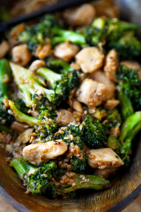 Easy chicken broccoli stir fry cooked in a simple savory sauce and ready in less than 20 minutes! This simple recipe is great if you are busy but still want homemade Chinese! | pickledplum.com