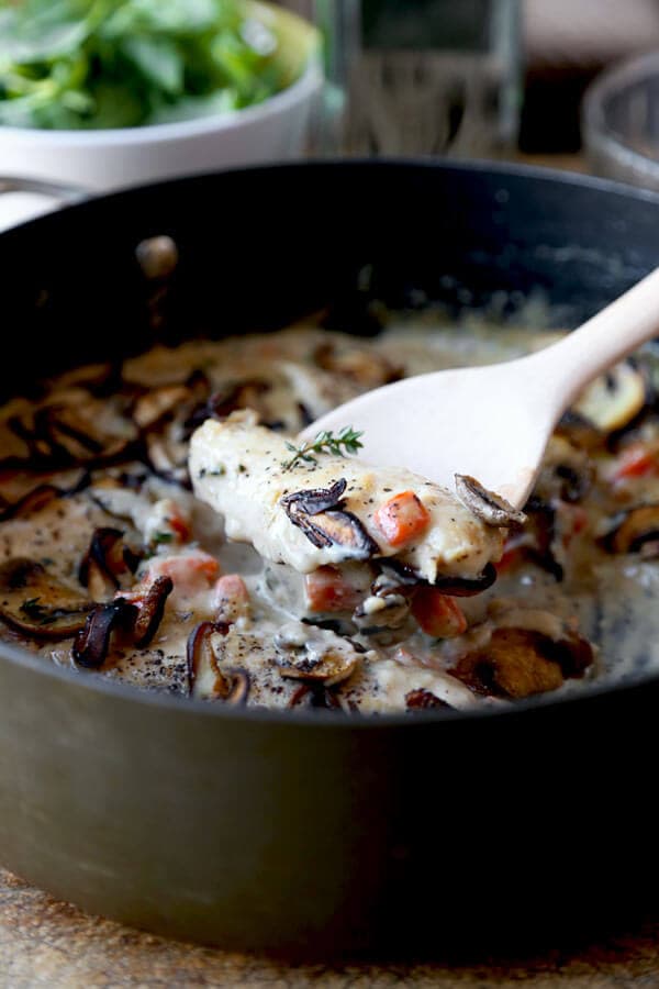 Simple and rustic Cream Of Mushroom Chicken with chopped carrots, fresh mushrooms & thyme. Family friendly and ready in under 20 minutes!