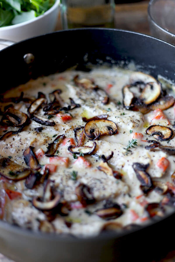 Simple and rustic Cream Of Mushroom Chicken with chopped carrots, fresh mushrooms & thyme. Family friendly and ready in under 20 minutes!