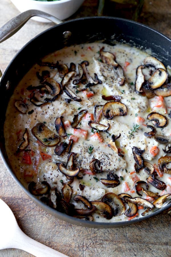 Simple and rustic Cream Of Mushroom Chicken with chopped carrots, fresh mushrooms & thyme. Family friendly and ready in under 20 minutes!