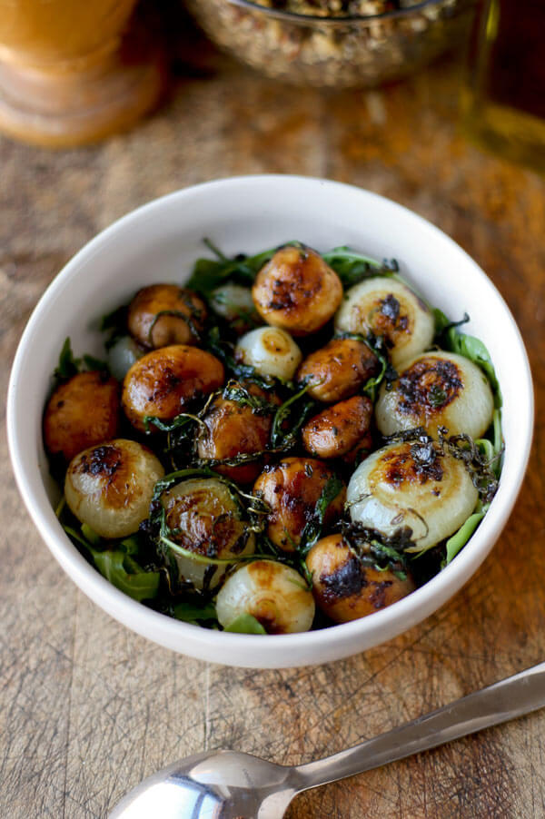 This sauteed mushrooms and onions recipe makes a stunning side dish! Sweet pearl onions and earthy mushrooms are pan fried with butter, paprika and salt and finished in the oven. Ah-mazing! Vegetarian, Easy, Healthy | pickledplum.com