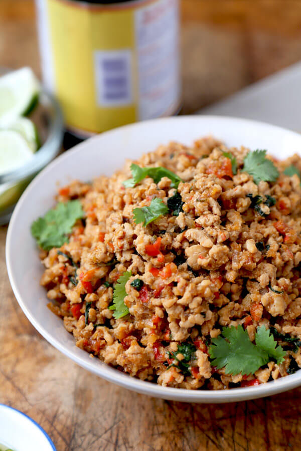 Thai Basil Chicken - This easy Thai basil chicken recipe is based on the classic Thai Krapow Gai Kai Dow dish. It's hot, pungent, salty and smoky. Squeeze a fresh lime on top and your taste buds will be dancing in no time! | pickledplum.com
