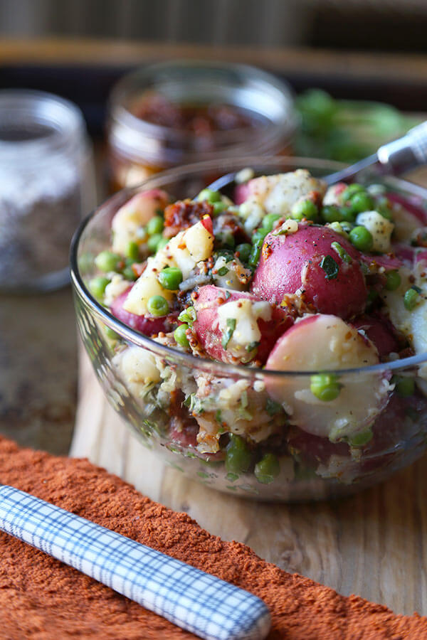 Healthy Red Potato Salad - A deliciously healthy and tangy red potato salad with sun dried tomatoes, green peas and basil, tossed in a light mustard and vinegar dressing. Ready in 15 minutes! 