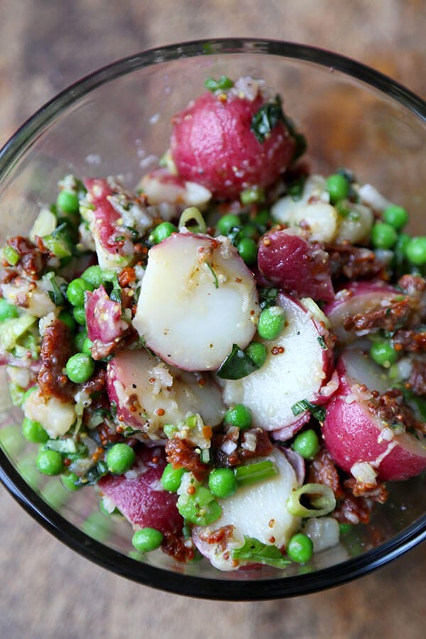 Healthy Red Potato Salad - A deliciously healthy and tangy red potato salad with sun dried tomatoes, green peas and basil, tossed in a light mustard and vinegar dressing. Ready in 15 minutes! 