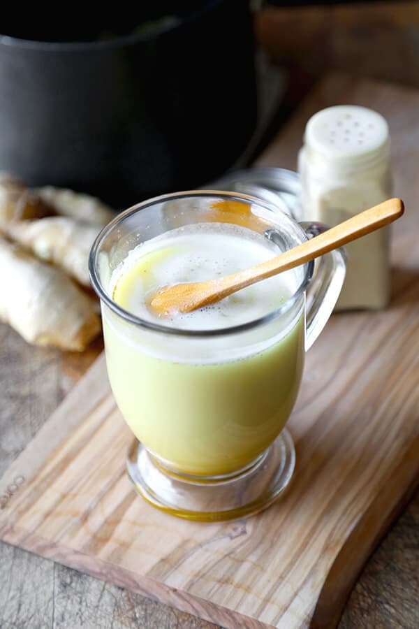 Honey Ginger and Turmeric Latte - This spicy honey, ginger and turmeric latte is the perfect beverage to soothe a sore throat, achy head and a stuffed up nose. Drink | pickledplum.com