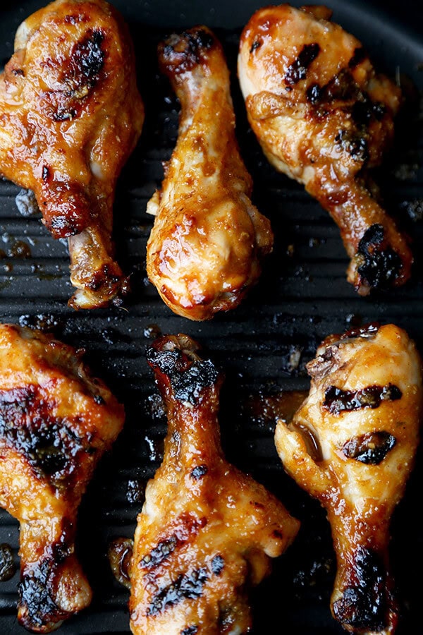 Hoisin Chicken with Pickled Cucumber Salad - Baked chicken drumsticks glazed with a sweet and tangy hoisin sauce that's finger licking good! Simple and easy and the perfect companion to a bowl of steamed white rice! | pickledplum.com