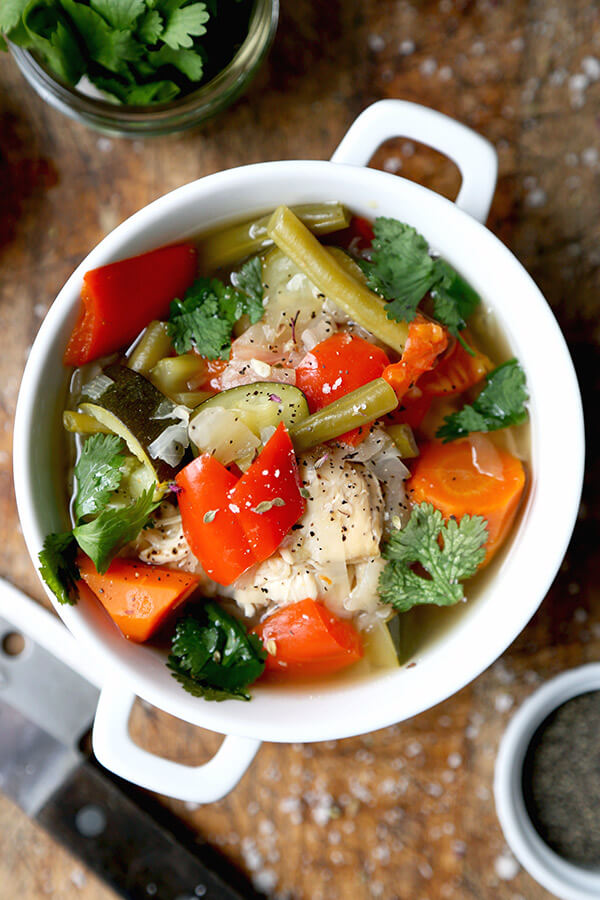 slow-cooker-chicken-soup - Slow Cooker Chicken Soup - This simple slow cooker chicken soup is packed with veggies and simmered in a light and delicate chicken stock. It's low in calories and fat and only takes 10 minutes to prep. Gluten free, weight loss. | pickledplum.com