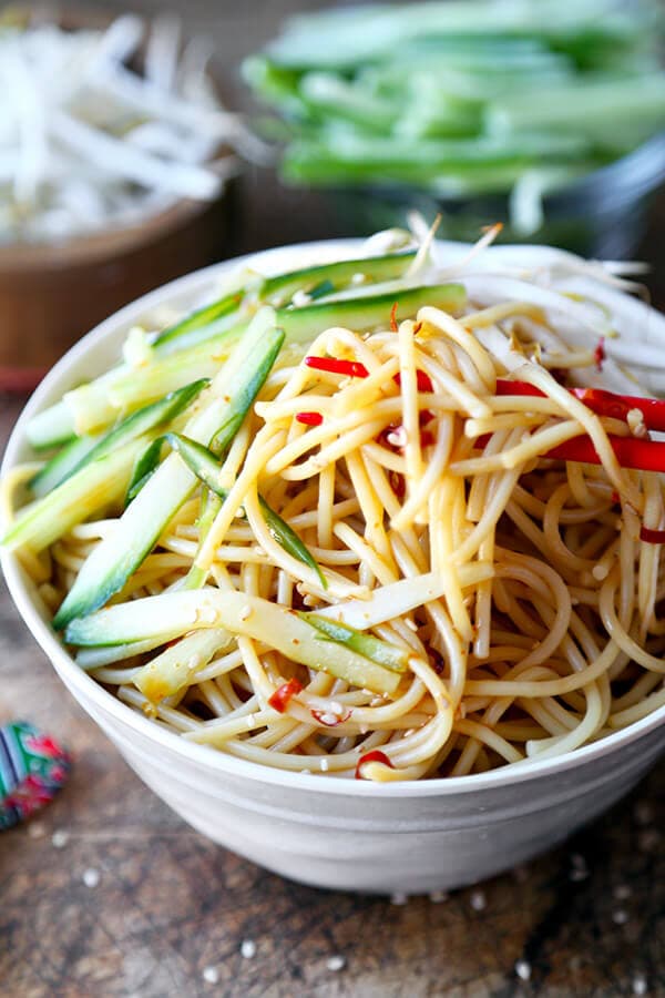 Cold Asian Noodle Salad - This is a quick and easy, spicy and nutty cold Asian noodle salad your whole family will love! Perfect for a barbecue or as a light lunch or dinner + ready in just 15 minutes! Recipe, Easy, Noodles, Healthy, Salad, Vegetarian, Vegan | pickledplum.com