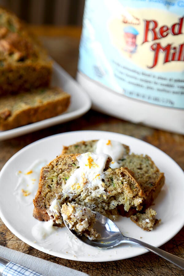 Gluten free zucchini bread - Serve this yummy gluten free zucchini bread as part of your Easter Sunday brunch this year! Topped with a honey orange yogurt sauce, it's the perfect balance of sweet and sour! Easy, gluten free, baking, recipe | pickledplum.com