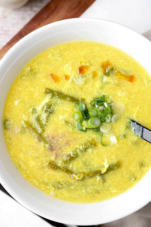 Asparagus and Lemon Egg Drop Soup - Refreshing and cleansing is what you will think of when you take a sip of this delicious asparagus and lemon egg drop soup. It's the perfect soup for warm and sunny days! Recipe, easy, healthy, soup, eggs, Chinese, better than takeout | pickledplum.com