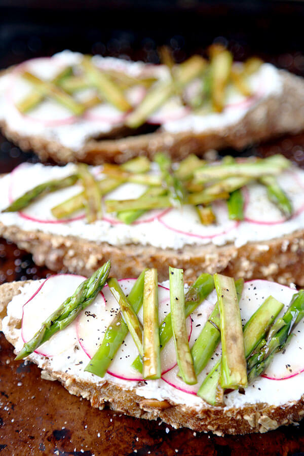 Breakfast Asparagus, Radish and Ricotta Toast - Creamy, salty and healthy - this breakfast asparagus, radish and ricotta toast is finished with a drizzle of honey for a stunning looking morning meal. Plus, it's really easy to make! Recipe, healthy, easy, brunch, crostini, snack, tartine | pickledplum.com