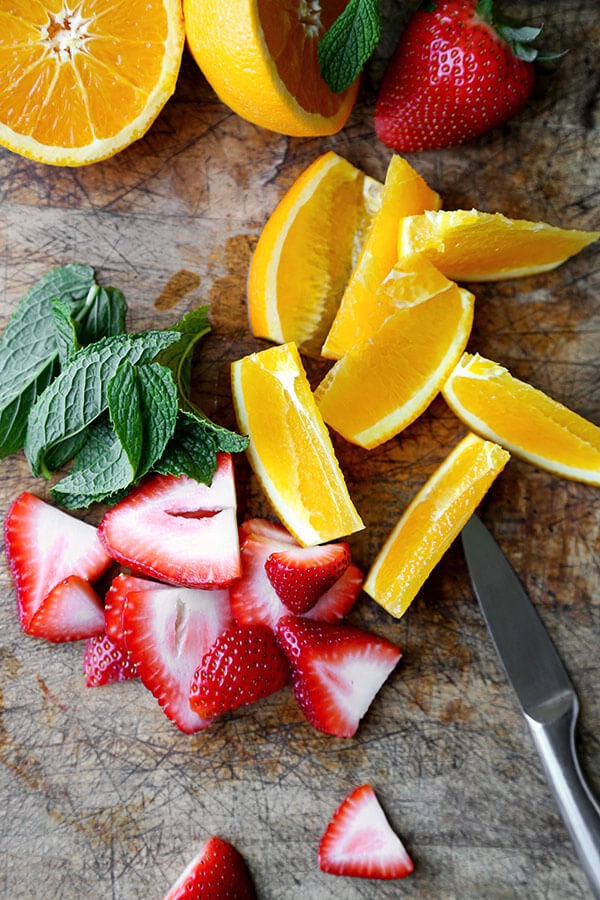 chopped strawberries, orange and mint