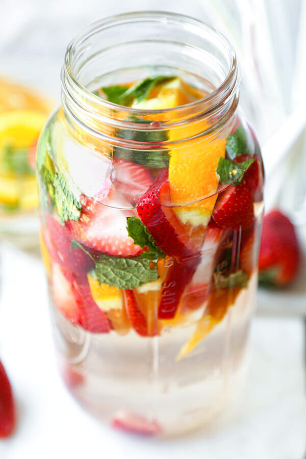 Strawberry Detox Water-Make this slimming, cleansing and naturally sweet Strawberry Detox Water in 5 minutes or less. Lose weight the yummy way with this zero calorie fruity drink. #fatburning #waterrecipes #detoxdrink #weightlossdrink #slimmingrecipes | pickledplum.com