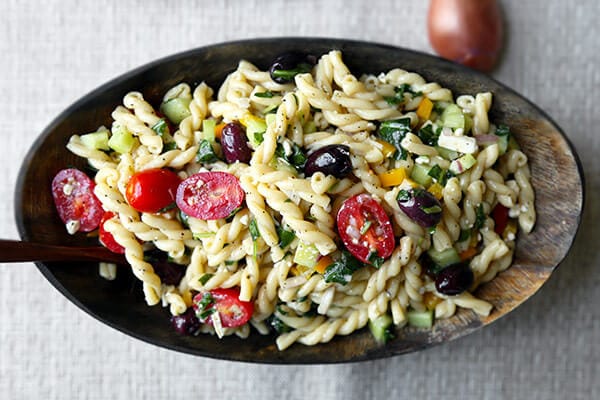 Greek Pasta Salad - This is a light, refreshing and tangy Greek pasta salad recipe packed with veggies for a wholesome meal! Ready in 25 minutes from start to finish. Recipe, salad, side, main, healthy, easy | pickledplum.com