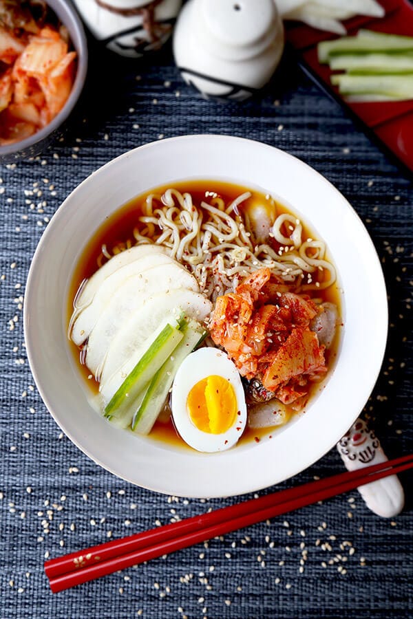 Shirataki Cold Noodle Soup - Healthy, refreshing and good for your bikini body! This ice cold shirataki noodle soup topped with sweet pear and spicy kimchi is only 222 calories per servings and filling enough to be eaten as a meal! Recipe, soup, low calories, diet, weight loss, noodles, healthy, noodle soup | pickledplum.com