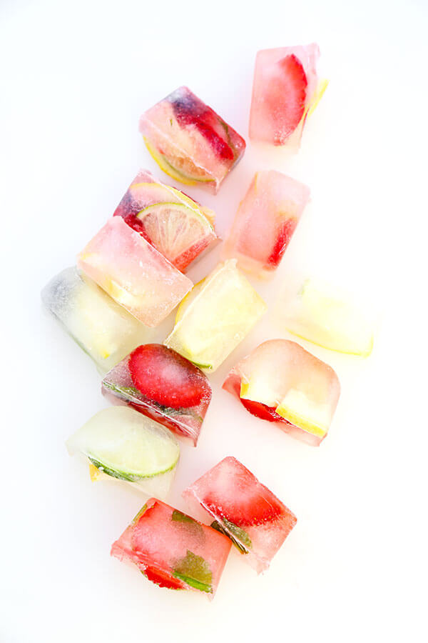 Fruity Ice Cubes - Chilly, citrus filled summer relief is the name of the game with this super simple Fruity Ice Cubes Recipe. Recipe, drinks, fruit, healthy, beverage | pickledplum.com