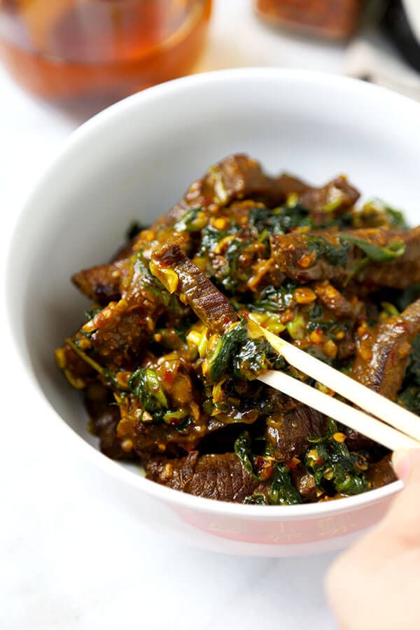 Hunan Beef Recipe - A smoky bowl of Hunan Beef With Cumin loaded with umami flavor and healthy kale. This Chinese-inspired recipe is ready in 20 minutes from start to finish! Recipe, beef, stir fry, Chinese, main, dinner | pickledplum.com