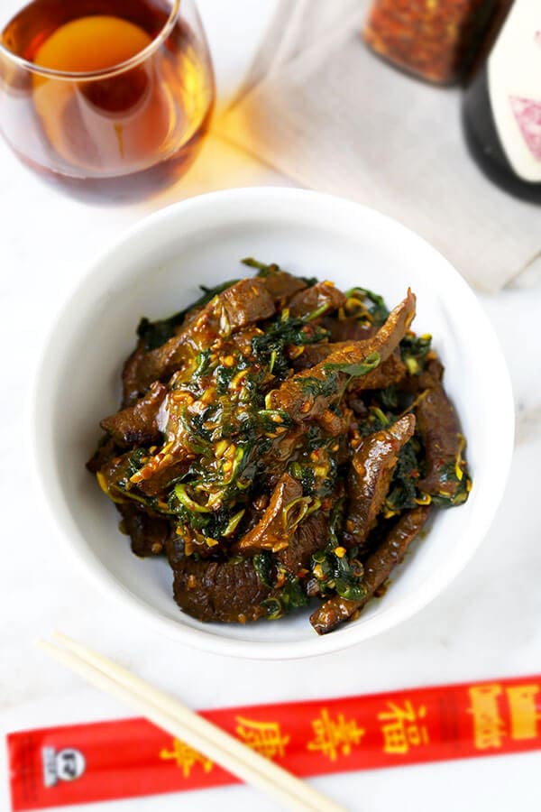 Hunan Beef Recipe - A smoky bowl of Hunan Beef With Cumin loaded with umami flavor and healthy kale. This Chinese-inspired recipe is ready in 20 minutes from start to finish! Recipe, beef, stir fry, Chinese, main, dinner | pickledplum.com