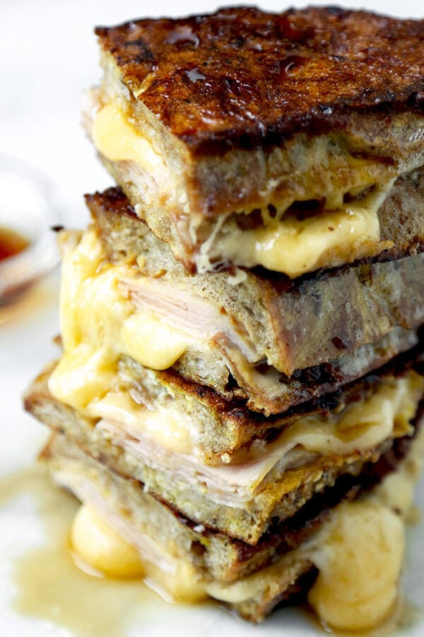 Monte Cristo Sandwich - This Monte Cristo Sandwich Recipe delivers on the gooey, savory perfection of grilled cheese and the sweetness of French Toast. Ready in 10 minutes from start to finish! Recipe, sandwich, grilled cheese, snack, brunch, breakfast, easy | pickledplum.com