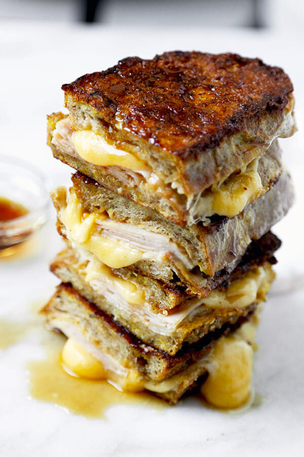 Monte Cristo Sandwich - This Monte Cristo Sandwich Recipe delivers on the gooey, savory perfection of grilled cheese and the sweetness of French Toast. Ready in 10 minutes from start to finish! Recipe, sandwich, grilled cheese, snack, brunch, breakfast, easy | pickledplum.com