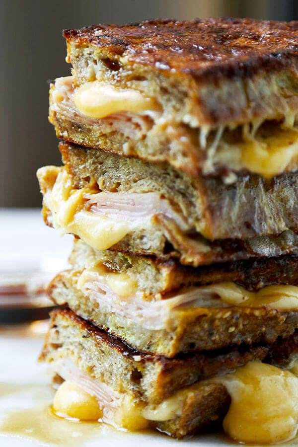 Monte Cristo Sandwich - This Monte Cristo Sandwich Recipe delivers on the gooey, savory perfection of grilled cheese and the sweetness of French Toast. Ready in 10 minutes from start to finish! Recipe, sandwich, grilled cheese, snack, brunch, breakfast, easy | pickledplum.com