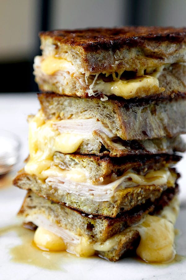 Monte Cristo Sandwich - This Monte Cristo Sandwich Recipe delivers on the gooey, savory perfection of grilled cheese and the sweetness of French Toast. Ready in 10 minutes from start to finish! Recipe, sandwich, grilled cheese, snack, brunch, breakfast, easy | pickledplum.com