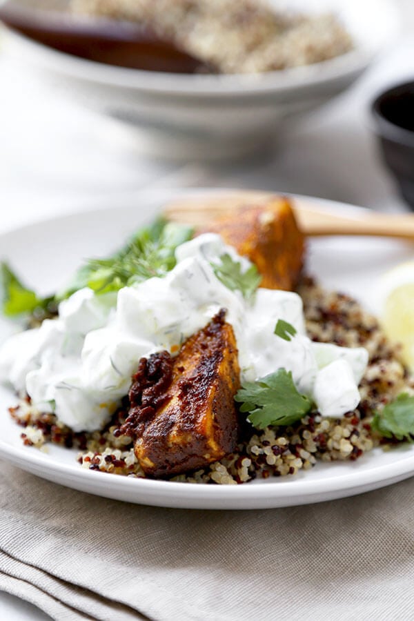 Salmon Tikka Over Quinoa - Put dinner on the table in 15 minutes with this smoky Salmon Tikka Over Quinoa Recipe, served with a cooling cucumber raita! Recipe, fish, salmon, healthy, main, dinner, curry | pickledplum.com