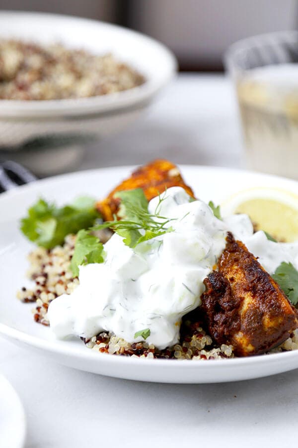 Salmon Tikka Over Quinoa - Put dinner on the table in 15 minutes with this smoky Salmon Tikka Over Quinoa Recipe, served with a cooling cucumber raita! Recipe, fish, salmon, healthy, main, dinner, curry | pickledplum.com