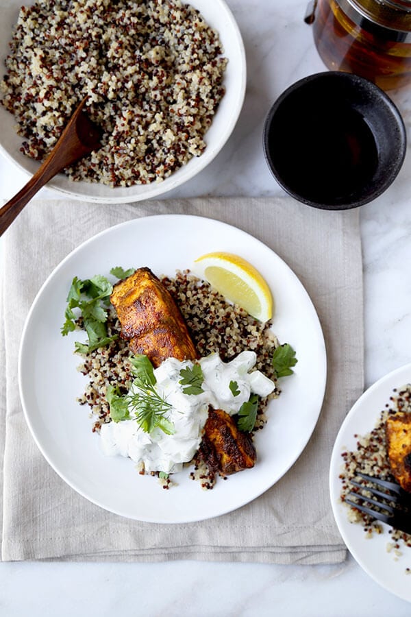 Salmon Tikka Over Quinoa - Put dinner on the table in 15 minutes with this smoky Salmon Tikka Over Quinoa Recipe, served with a cooling cucumber raita! Recipe, fish, salmon, healthy, main, dinner, curry | pickledplum.com