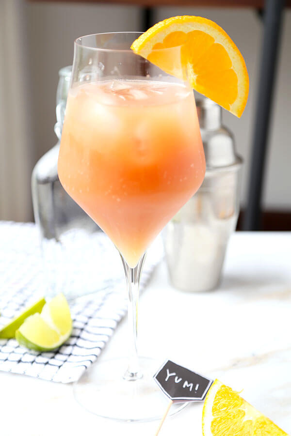 This Sex On The Beach cocktail just oozes fruity summer refreshment. Colored like a beautiful sunset, this is the perfect fruity mixed drink for a late-summer party! #howtomake #drinks #parties #fruitcocktail #alcoholicdrink #girlydrink | pickledplum.com