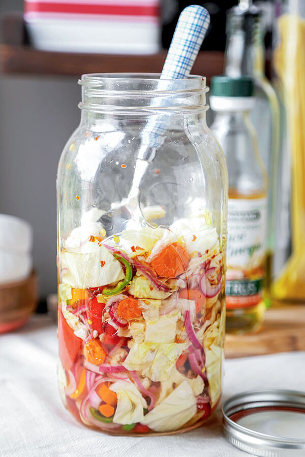 Spicy Pickled Vegetables - These spicy pickled vegetables are the perfect addition to salads and sandwiches. They are low in fat and calories and will make your next meal pop with bright flavors! Recipe, vegetarian, pickles, snack, gluten free, side | pickledplum.com