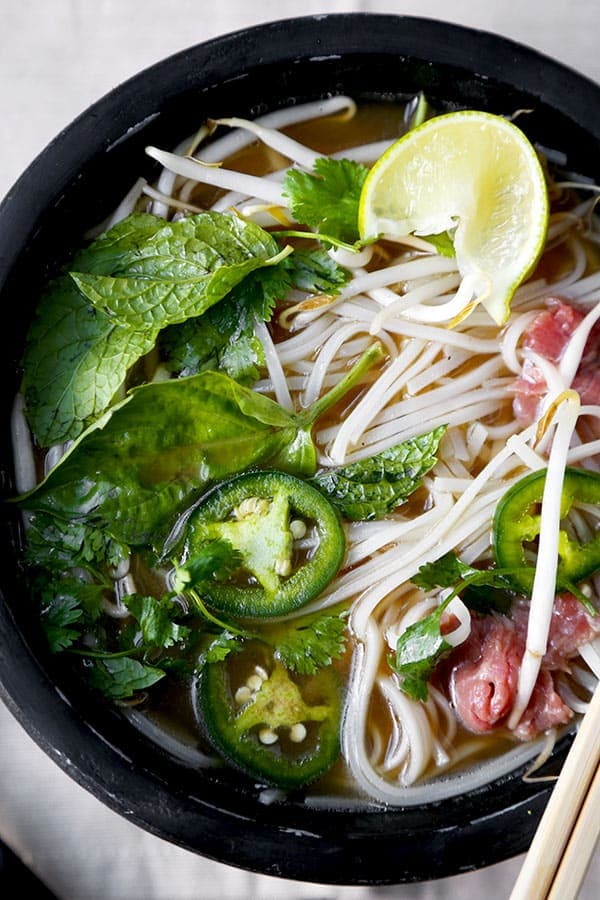 Easy Pho Soup - Slurp your noodles with abandon in 30 minutes with this Easy Pho Soup Recipe! A quick, satisfying and full-flavor version of Vietnam’s national dish. Recipe, soup, Vietnamese food, noodle soup, healthy, pho soup | pickledplum.com