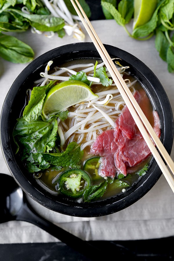 Easy Pho Soup - Slurp your noodles with abandon in 30 minutes with this Easy Pho Soup Recipe! A quick, satisfying and full-flavor version of Vietnam’s national dish. Recipe, soup, Vietnamese food, noodle soup, healthy, pho soup | pickledplum.com