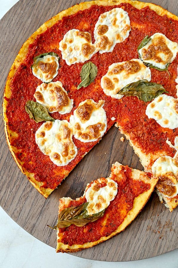 Cauliflower Pizza Crust Alla Margherita - A delicious Cauliflower Pizza Crust Alla Margherita Recipe that tastes just like a pizza-pie from your favorite pizzeria. Gluten Free and ready in 35 minutes! Recipe, gluten free, snack, pizza, healthy, Super Bowl | pickledplum.com